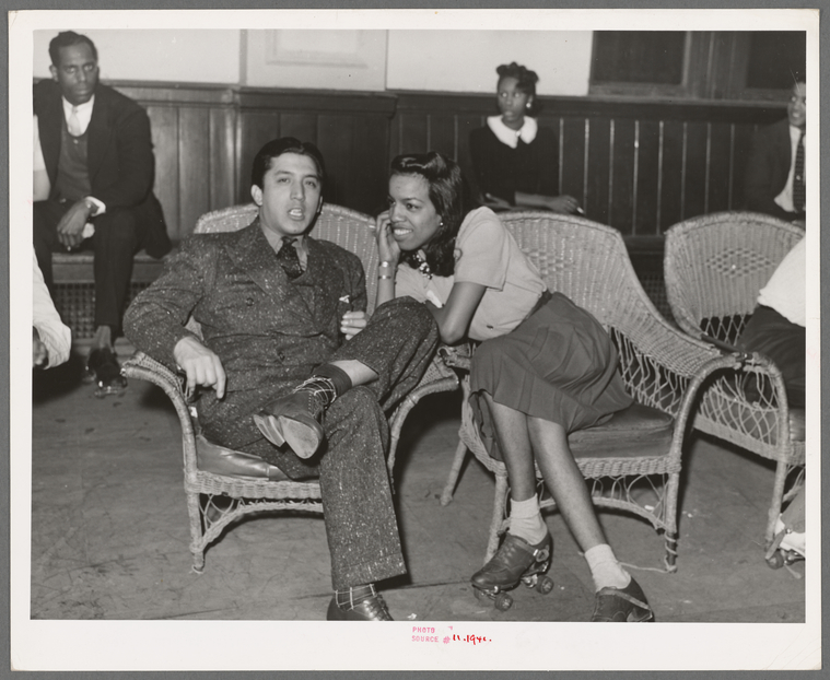 Couple roller skating at the savoy ball room