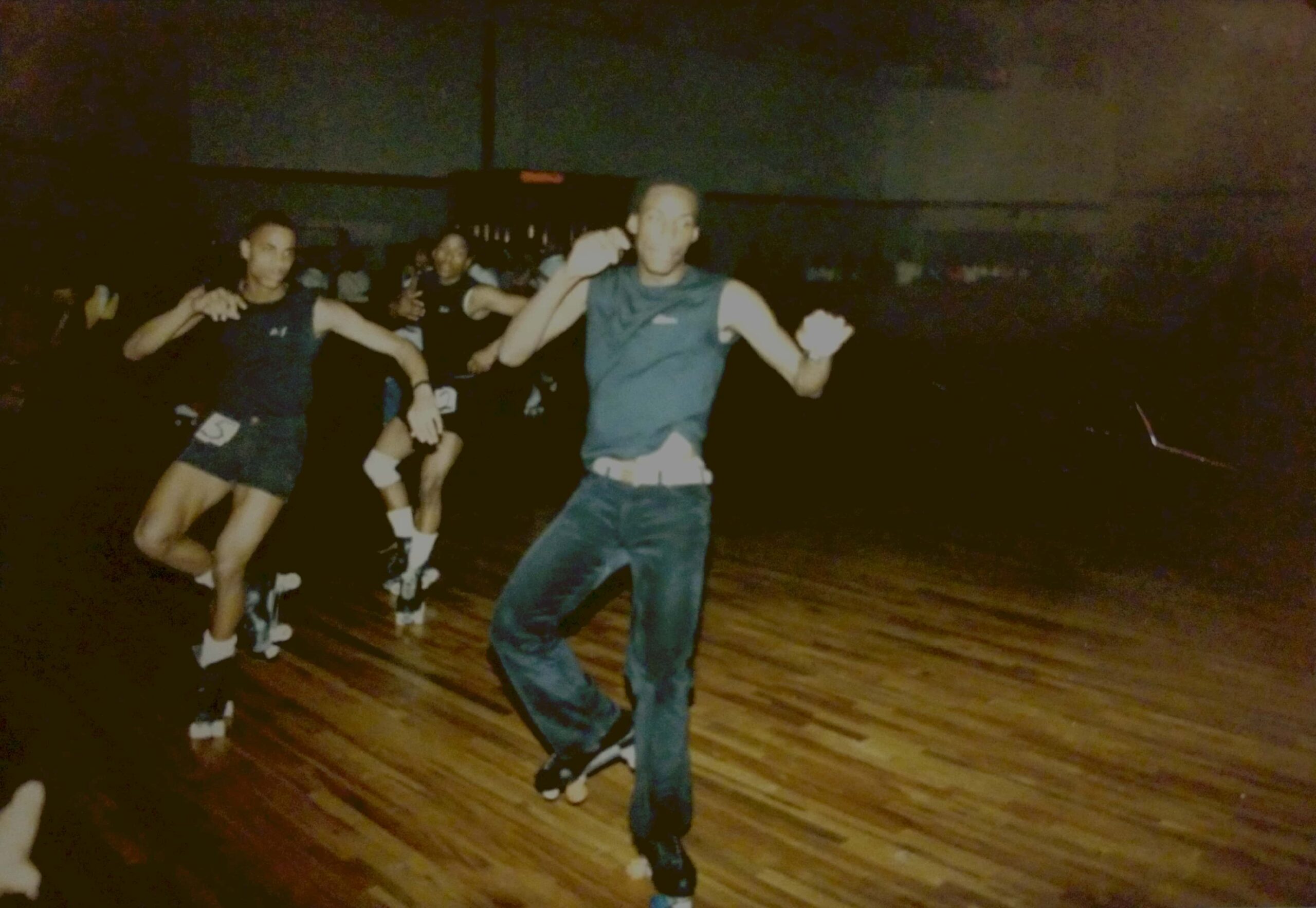 Men snapping on roller skates in baltimore