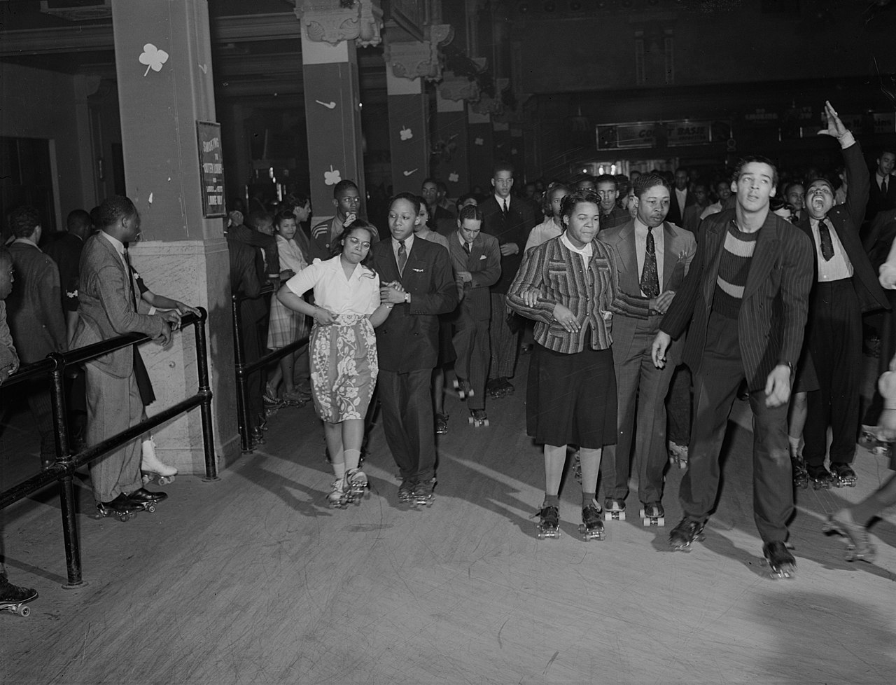 Group of people roller skating at the Savoy Bathroom in Chicago